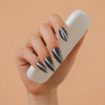 Dark Matter - Black cat-eye press-on nails, medium almond shape, magnetic shimmer finish. | worn on hand 2 | So Does Nails