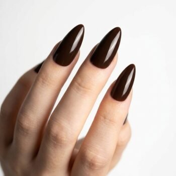 Deep Roast - Deep brown-red press-on nails, medium almond shape, glossy finish. | worn on hand 2 | So Does Nails