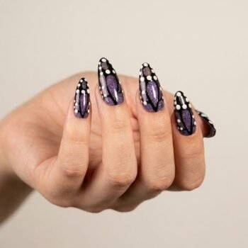 Galaxy Wings - Handmade black and purple glitter almond press-on nails with white dot accents. | worn on hand 2 | So Does Nails