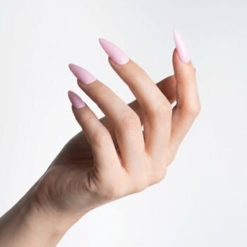 Glass Pink - Soft baby pink press-on nails, medium almond shape, glossy finish. | worn on hand 2 | So Does Nails