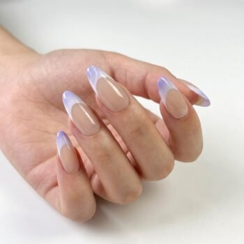 Lavender Shells - Handmade press-on nails featuring a nude base with lavender purple French tips. | worn on hand 2 | So Does Nails