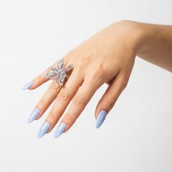 Misty Sky - Dusty pale blue press-on nails, medium almond shape, glossy finish. | worn on hand 2 | So Does Nails