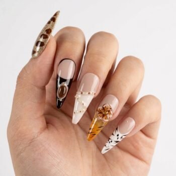 Molokai Sunset - Long stiletto press-on nails with leopard print, abstract waves, 3D flowers, and sunset orange gradient. | worn on hand 2 | So Does Nails