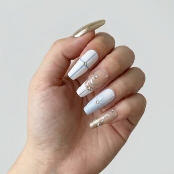 Nova Shell - Long coffin handmade press-on nails with gold chrome, white, and nude panels decorated with silver lines and rhinestones. | worn on hand 2 | So Does Nails