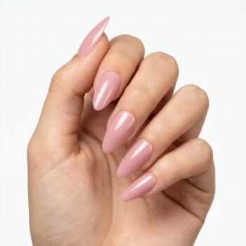 Nude Core - Nude pink press-on nails, medium almond shape, glossy finish. | worn on hand 2 | So Does Nails