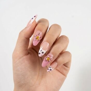 Pink Pounce - Almond French tip press-on nails with purple leopard spots and 3D pink floral accents. | worn on hand 2 | So Does Nails