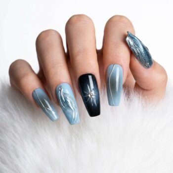 Silver Tide - Handmade coffin press-on nails featuring blue and black airbrushed gradients, dense silver glitter, a 3D metallic starburst with a pearl center, and raised silver chrome swirls. | worn on hand 2 | So Does Nails