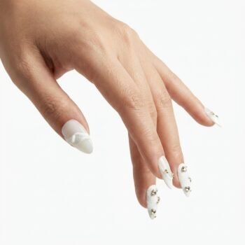 Snow Veil - Handmade almond press-on nails with a white sugar-texture finish and silver rhinestones. | worn on hand 2 | So Does Nails