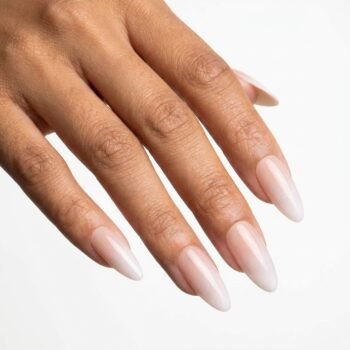 Soft Bloom - Handmade almond press-on nails with a soft pink-to-nude gradient and glossy finish. | worn on hand 2 | So Does Nails