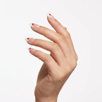 Sweet Tip - Handmade almond press-on nails with white French tips and small red heart accents. | worn on hand 2 | So Does Nails