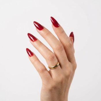 Berry Heat - Deep berry red press-on nails, medium almond shape, glossy finish. | worn on hand 2 | So Does Nails