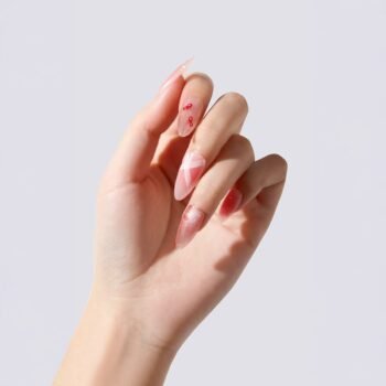 Blush Stardust - handmade press-on nails in a soft blush pink. Featuring shimmer, fine linework, and subtle metallic accents. | worn on hand 2 | So Does Nails